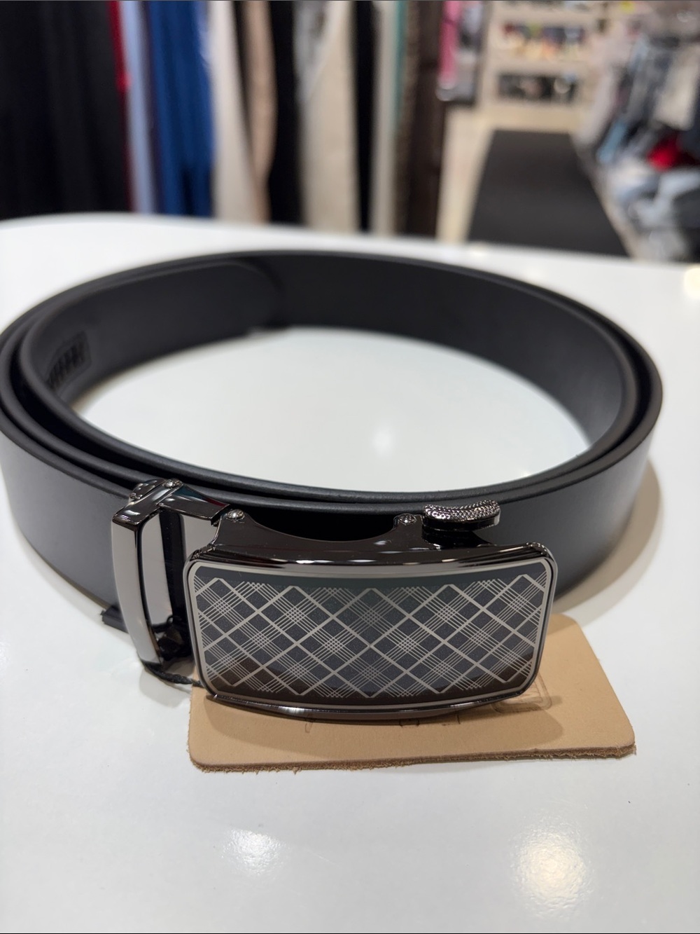 Stylish Black Leather Belt with Patterned Buckle